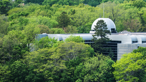 Ariel shot of the Boyd Law Building in the summer surrounded by trees 