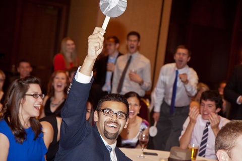 2018 EJF Auction event with someone raising their bid card to place a bid during the event