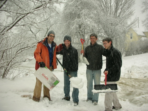 Students digging the car out of the snow after a bagel run during Ann Estin's EFJ auction brunch event