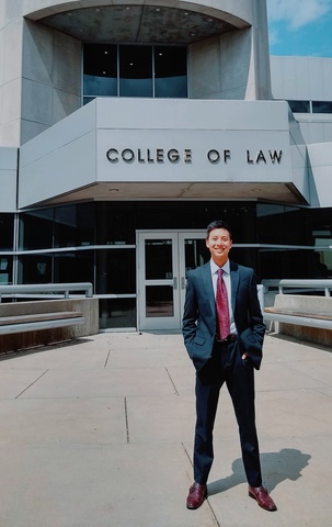 Ethan Chen JD student standing outside BLB on a sunny day