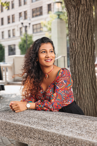 Alum Apoorva Gokare poses downtown Wilmington, DE.