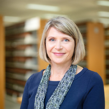 Dawn Barker Anderson poses in the Iowa Law Library