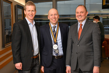 Professors Pettys and Yockey with Dean Washburn at Yockey's investiture ceremony