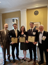 Chris and Coauthors holding award